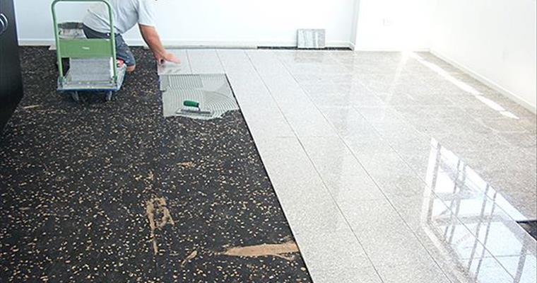 AcoustaMat installation under tiles